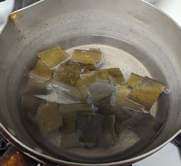 Place pot over heat and turn off heat just before boiling.